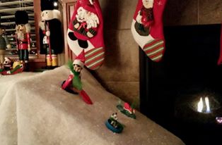 Sledding! Fake snow sheet and the lids to some peanut butter, marshmallow creme, etc. for sleds